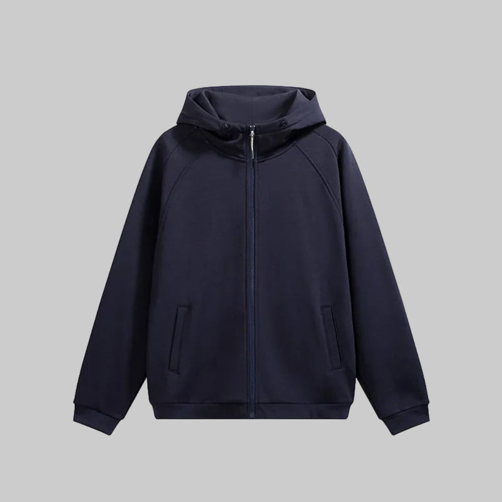 Hooded hardshell jacket in dark navy with full-zip front and adjustable hood.