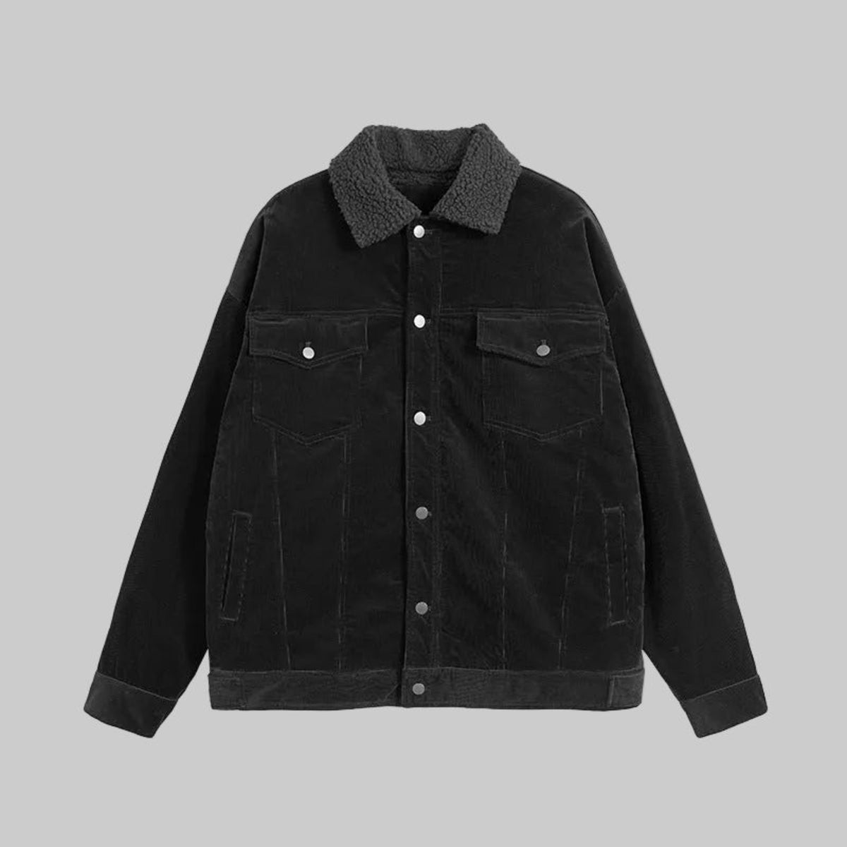 Black corduroy coat with pointed collar, snap buttons, and chest pockets
