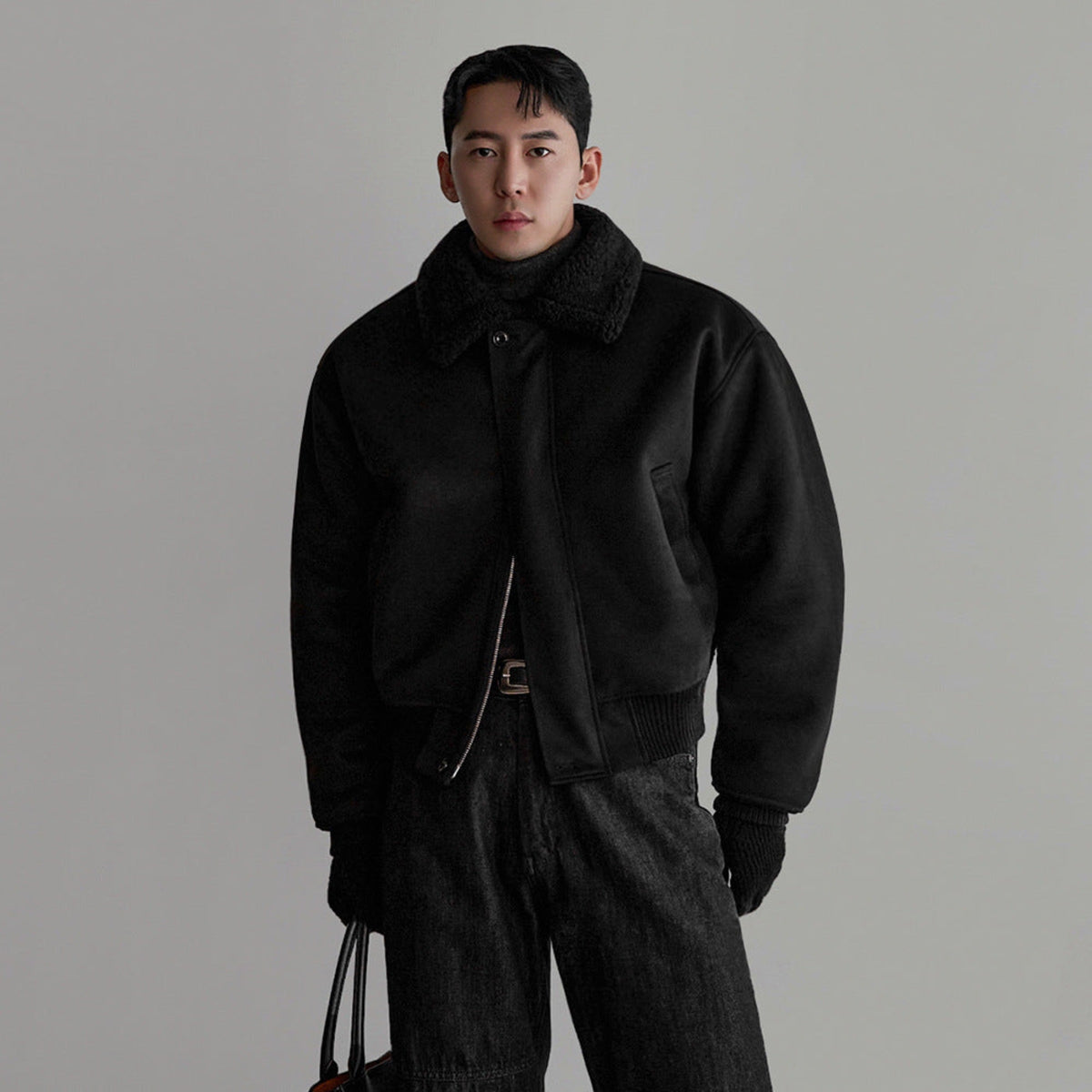 Black flight jacket with fleece collar, zip front, and flap chest pocket