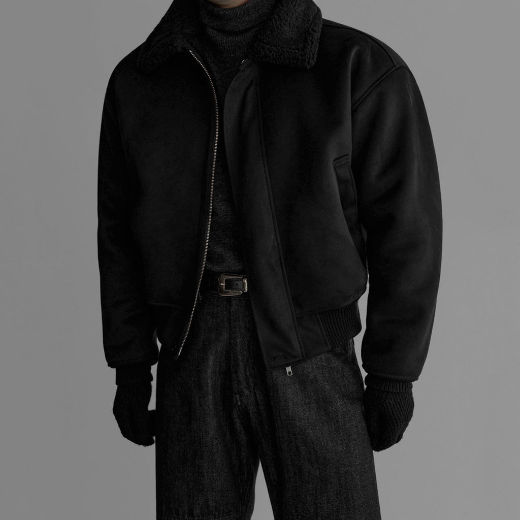 Black flight jacket with fleece-lined collar, zip front, and ribbed hem cuffs