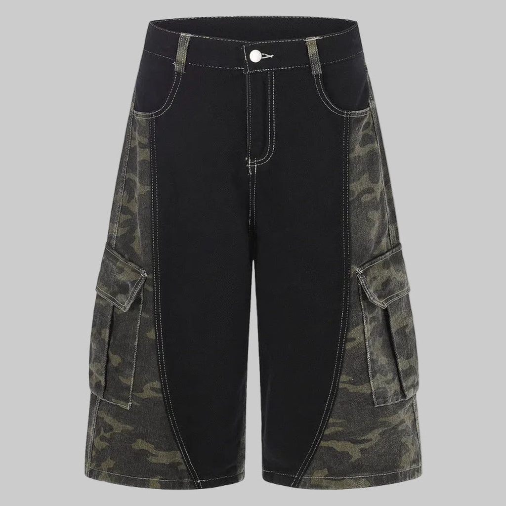 Wide-leg jeans with black front and camo patchwork side panels, cargo pockets