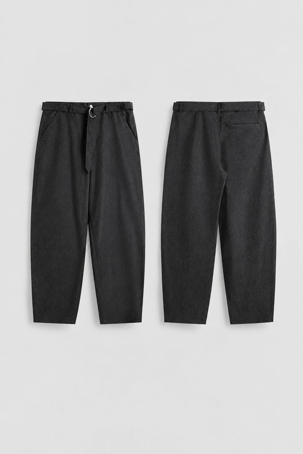 Relaxed tapered jeans pair, dark fabric, drawstring elastic waistband