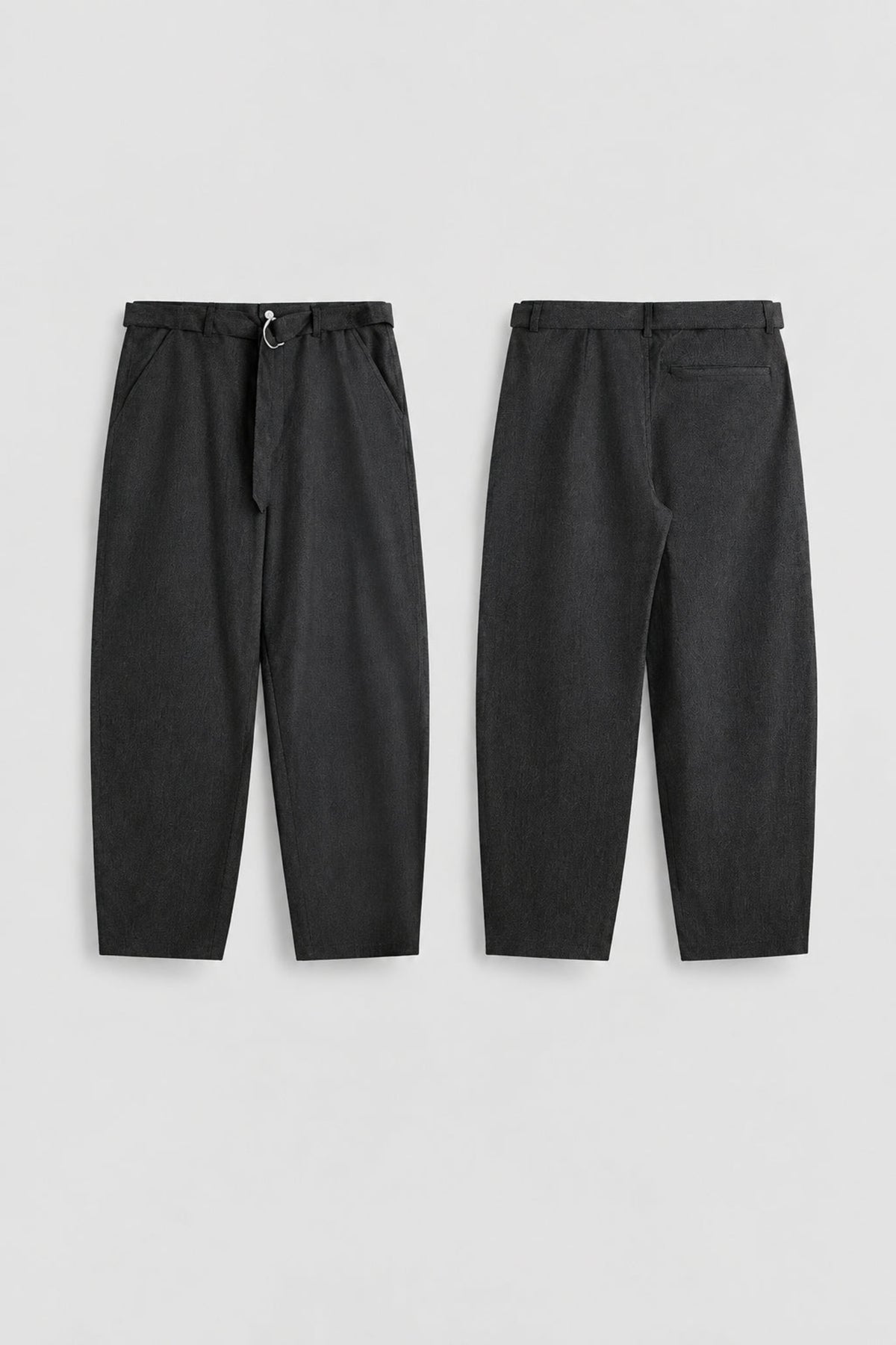 Relaxed tapered jeans pair, dark fabric, drawstring elastic waistband