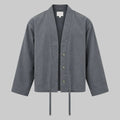 Charcoal relaxed utility jacket with button front, stand collar, drawstring hem