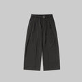 Charcoal relaxed wide-leg trousers with belt buckle, pleats, and side tie