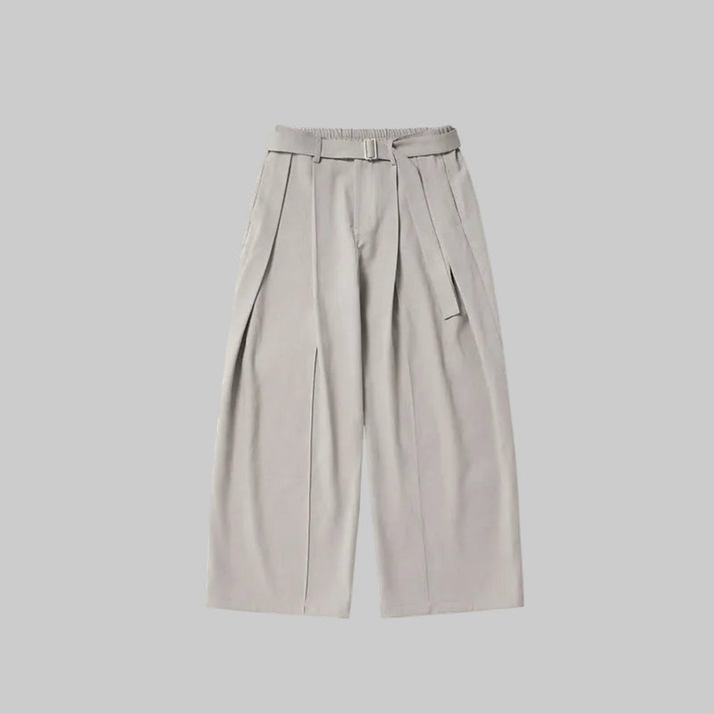 Pale ash relaxed wide-leg trousers with belt buckle, pleats, and side tie