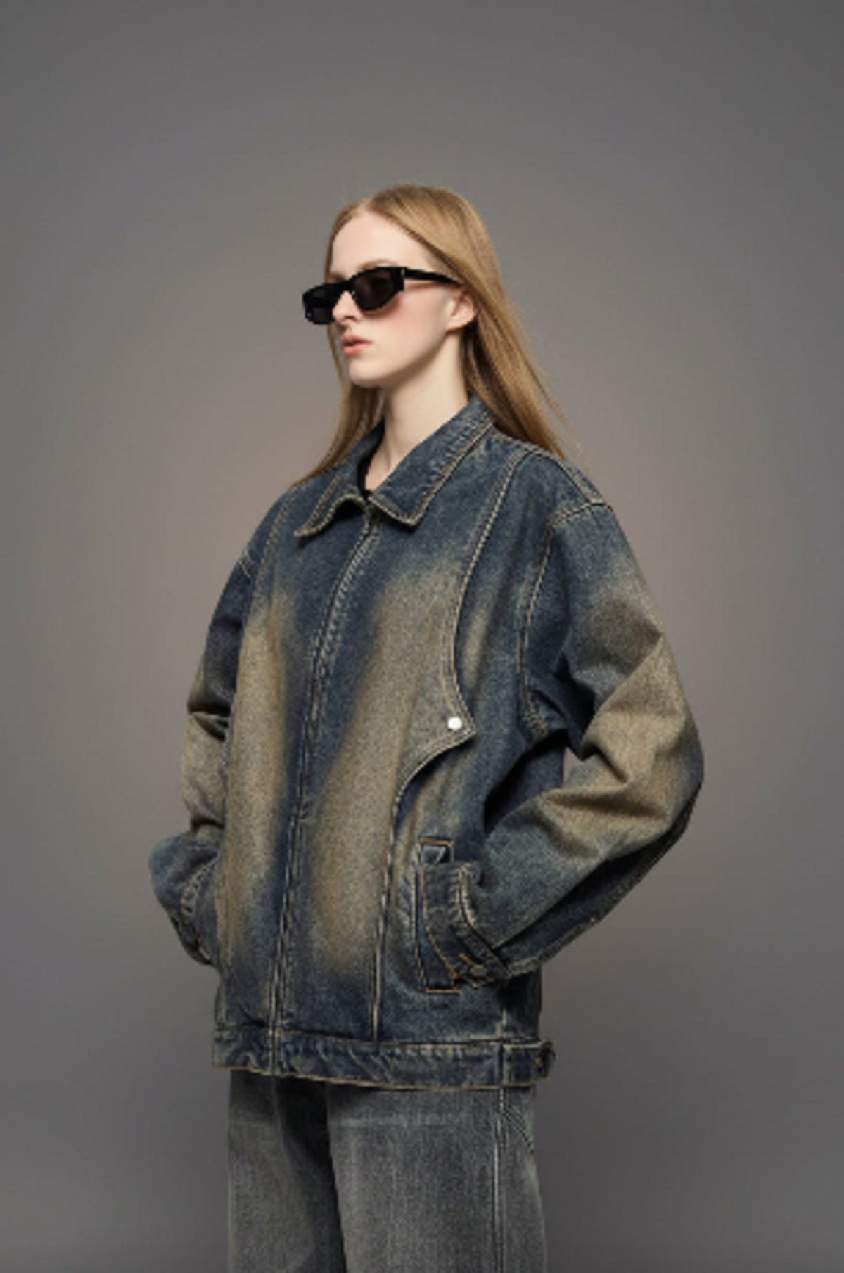 Vintage denim jacket with stand collar, snap pockets, and cuffed sleeves in dark wash