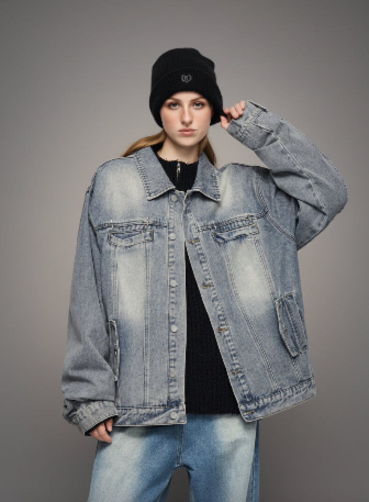 Light-wash denim jacket with button front, point collar, and two chest flap pockets
