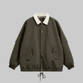 Dark utility jacket with plaid collar, button front, chest pockets, drawstring hem