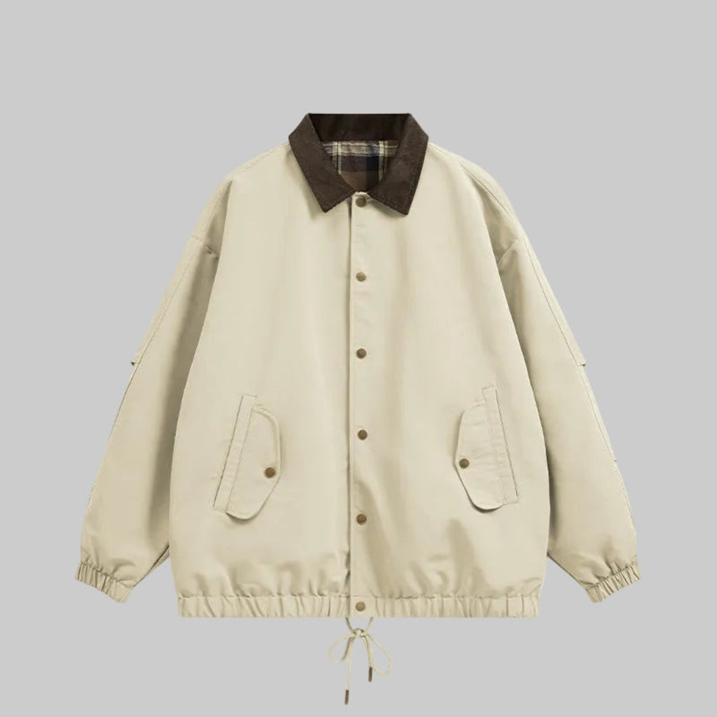 Light utility jacket with plaid collar, button front, chest pockets, drawstring hem