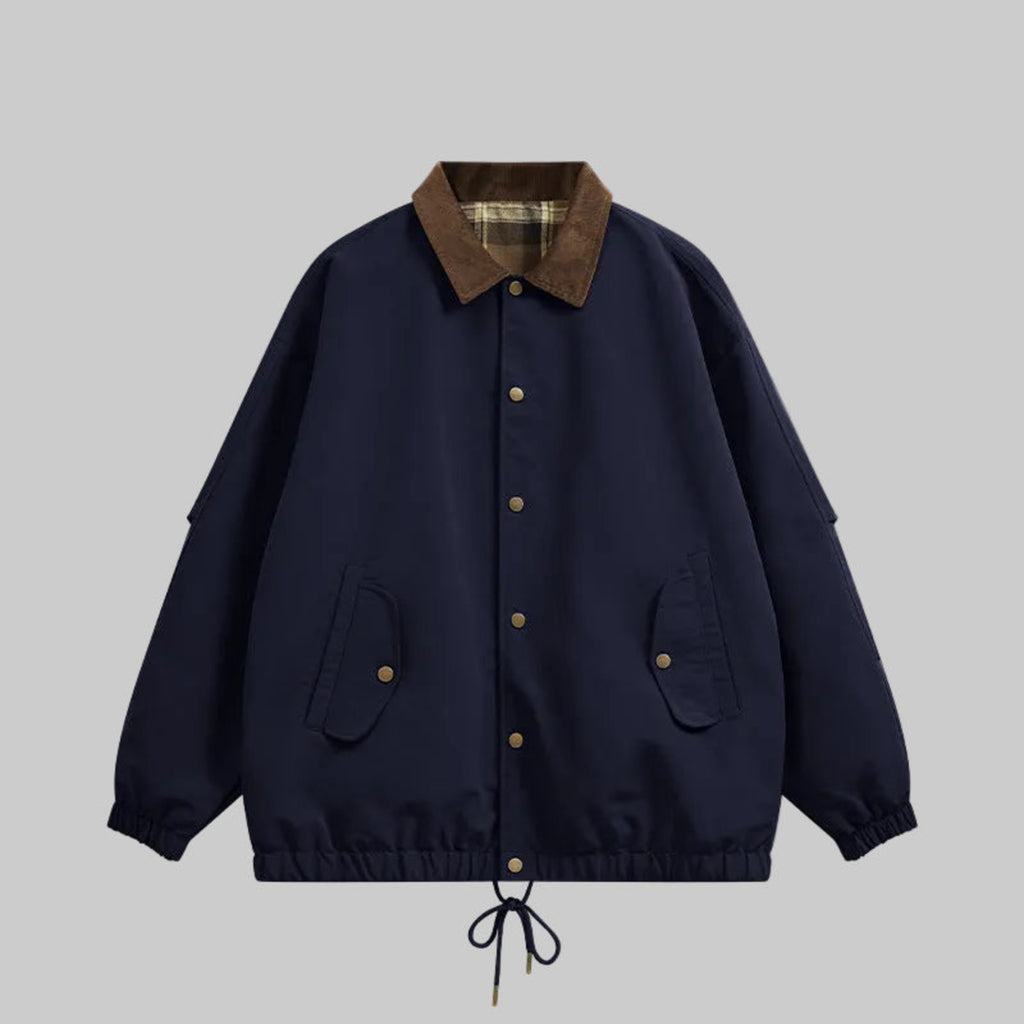 Navy utility jacket with plaid collar, button front, chest pockets, drawstring hem