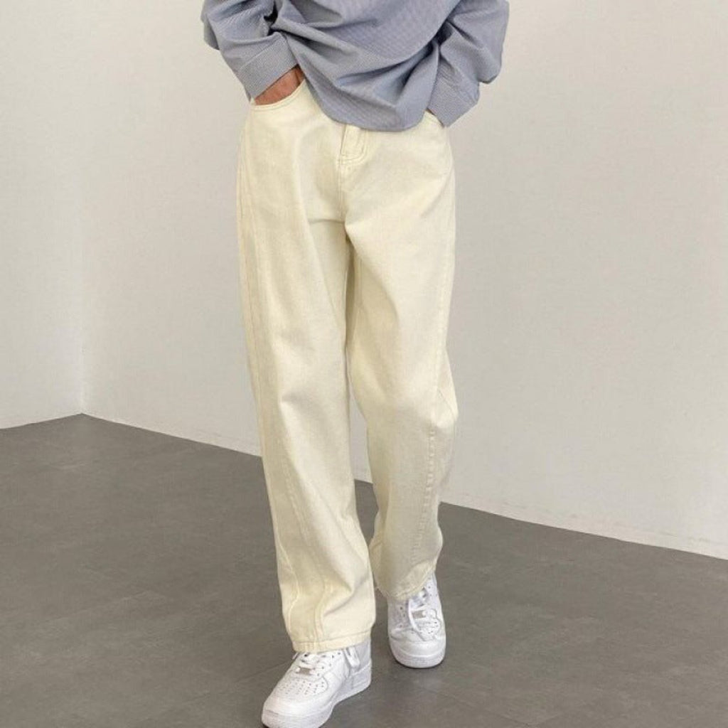 Ecru wide-leg denim trousers with cuffed hem detail and front button closure